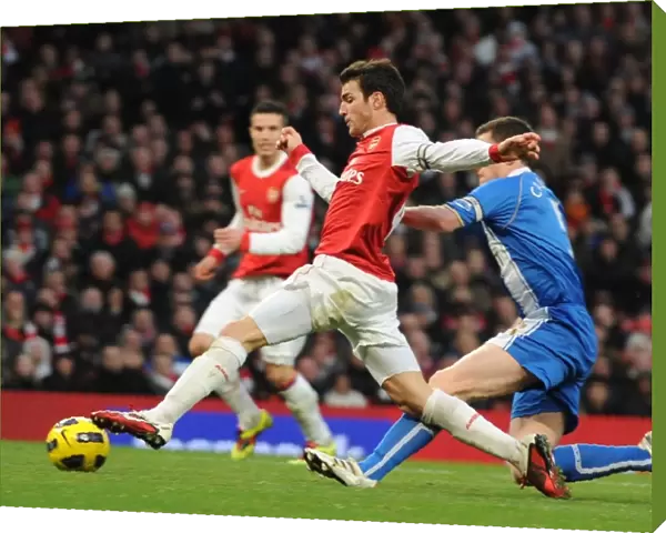 Cesc Fabregas (Arsenal) is tripped by Gary Caldwell (Wigan). Arsenal 3: 0 Wigan Athletic
