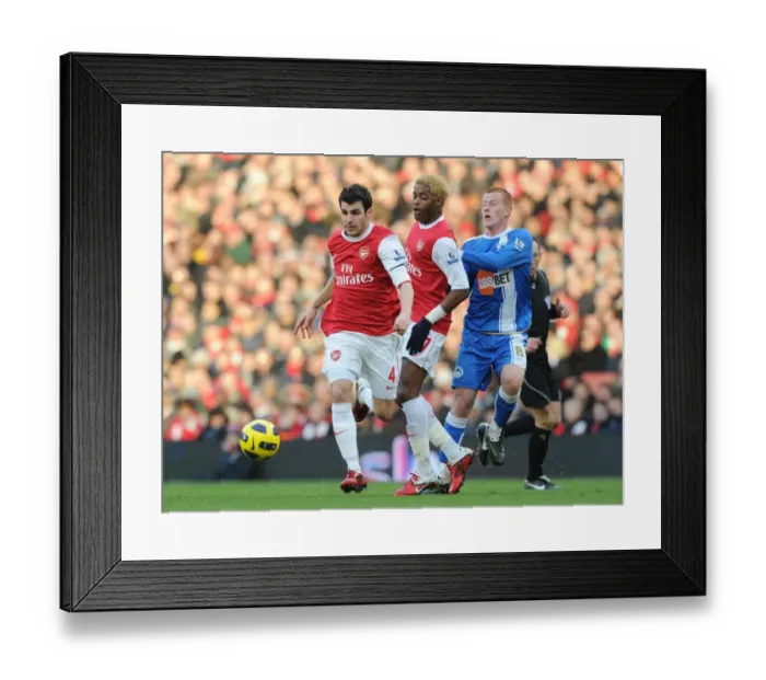 Framed Print : Cesc Fabregas and Alex Song (Arsenal) Ben Watson (Wigan) with mascots and officials before the match. Arsenal 3: 0 Wigan Athletic. Barclays Premier League, Emirates Stadium, Arsenal Football Club, London, 22  /  1  /  2011. Credit : Stuart MacFarlane  /  Arsenal