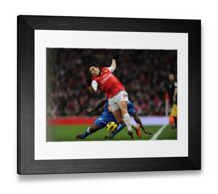 Framed Print : Samir Nasri (Arsenal) Steve Gohouri (Wigan). Arsenal 3: 0 Wigan Athletic Framed Print : Samir Nasri (Arsenal) Steve Gohouri (Wigan). Arsenal 3: 0 Wigan Athletic