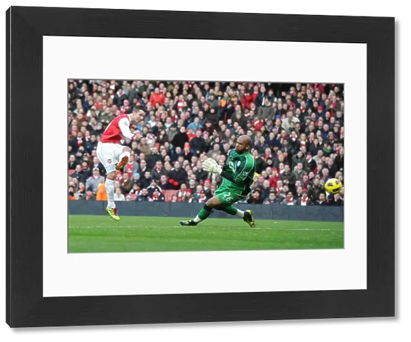 Robin van Persie shoots past Wigan goalkeeper Ali Al Habsi to score the 1st Arsenal goal