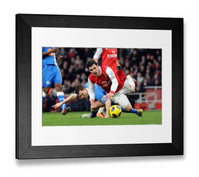 Framed Print : Cesc Fabregas (Arsenal) is fouled by Gary Caldwell (Wigan) for the Arsenal penalty