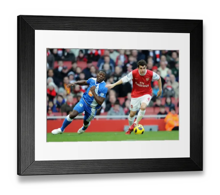 Framed Print : Cesc Fabregas (Arsenal) Hendry Thomas (Wigan). Arsenal 3: 0 Wigan Athletic Framed Print : Cesc Fabregas (Arsenal) Hendry Thomas (Wigan). Arsenal 3: 0 Wigan Athletic