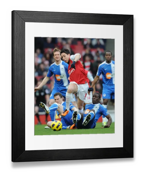 Framed Print : Arsenal's Triumph: Nasri's Brilliance Leads to 3-0 Win Over Wigan's Caldwell and Thomas Framed Print : Arsenal's Triumph: Nasri's Brilliance Leads to 3-0 Win Over Wigan's Caldwell and Thomas