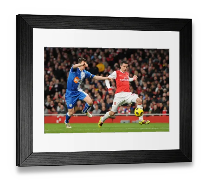 Framed Print : Robin van Persie's Intense Strike: Arsenal's 2-0 Against Wigan Athletic in the Premier League