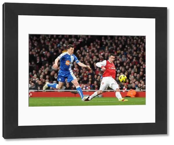 Robin van Persie scores his and Arsenals 2nd goal under pressure from Gary Caldwell