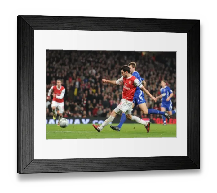 Framed Print : Cesc Fabregas shoots past Ipswich goalkeeper Marton Fulop to score the 3rd Arsenal goal