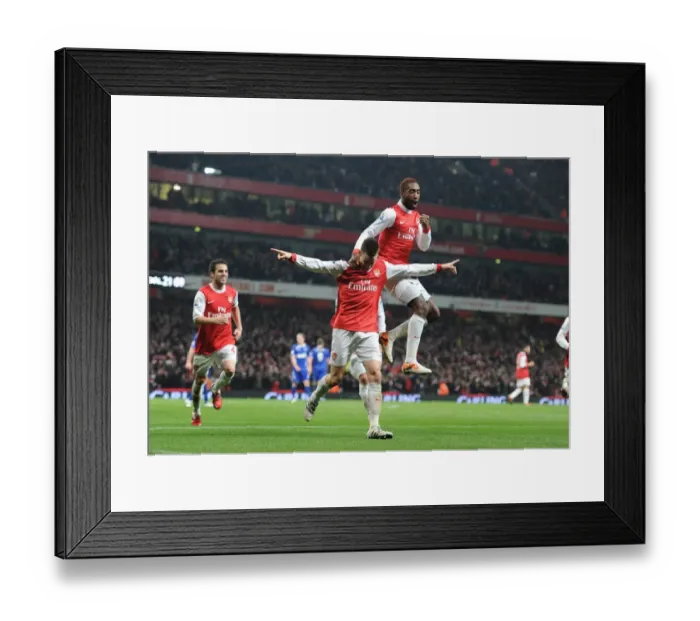 Framed Print : Arsenal's Triumph: Koscielny, Djourou, and Fabregas Celebrate Second Goal in Carling Cup Semi-Final Victory Framed Print : Arsenal's Triumph: Koscielny, Djourou, and Fabregas Celebrate Second Goal in Carling Cup Semi-Final Victory