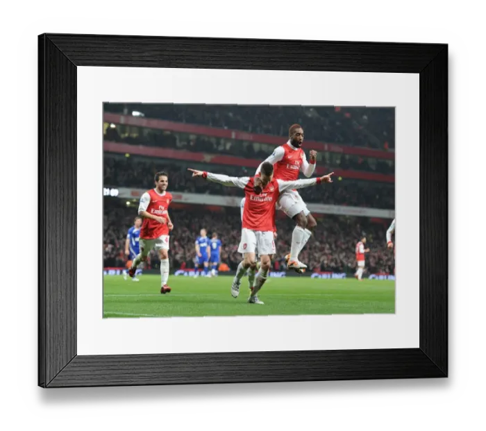 Framed Print : Arsenal's Triumph: Koscielny, Djourou, and Fabregas Celebrate Second Goal in Carling Cup Semi-Final Victory Against Ipswich Town (3:0, 3:1 agg)