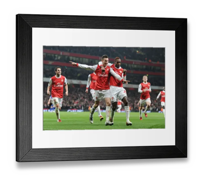 Framed Print : Arsenal's Koscielny, Djourou, and Fabregas: Celebrating the Second Goal in Carling Cup Semi-Final Victory over Ipswich Town (3:0, 3:1 agg) Framed Print : Arsenal's Koscielny, Djourou, and Fabregas: Celebrating the Second Goal in Carling Cup Semi-Final Victory over Ipswich Town (3:0, 3:1 agg)
