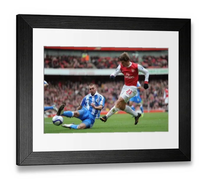 Framed Print : Arsenal's Andrey Arshavin Scores the Winner Against Huddersfield's Jack Hunt in FA Cup Fourth Round
