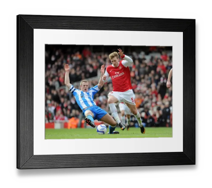 Framed Print : Nicklas Bendtner (Arsenal) Peter Clarke (Huddersfield). Arsenal 2: 1 Huddersfield Town