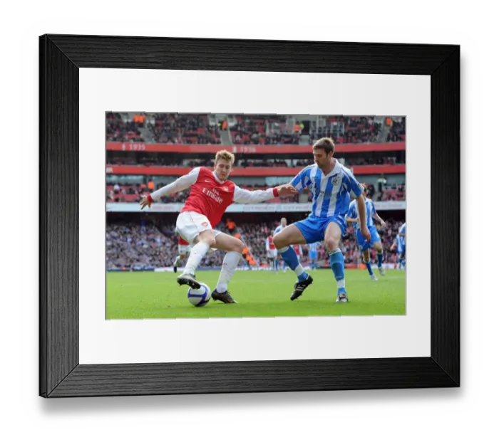Framed Print : Nicklas Bendtner (Arsenal) Jamie McCombe (Huddersfield). Arsenal 2: 1 Huddersfield Town Framed Print : Nicklas Bendtner (Arsenal) Jamie McCombe (Huddersfield). Arsenal 2: 1 Huddersfield Town