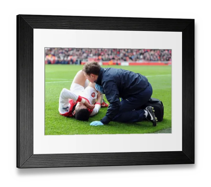 Framed Print : Denilson (Arsenal) with physio Colin Lewin. Arsenal 2: 1 Huddersfield Town Framed Print : Denilson (Arsenal) with physio Colin Lewin. Arsenal 2: 1 Huddersfield Town