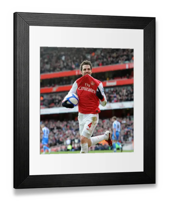Framed Print : Cesc Fabregas celebrates scoring Arsenals 2nd goal. Arsenal 2: 1 Huddersfield Town