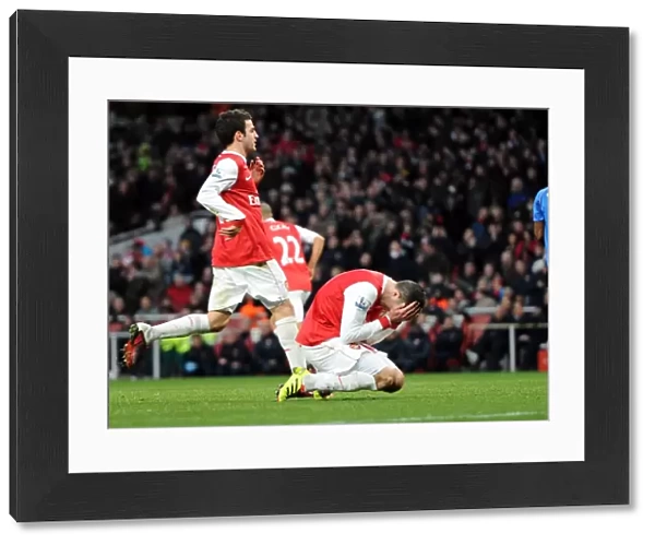 Robin van Persie (Arsenal) reacts to missing from the penalty spot. Arsenal 3