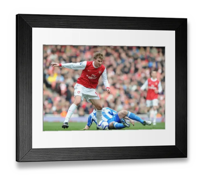 Framed Print : Nicklas Bendtner (Arsenal) Tom Clarke (Huddersfield). Arsenal 2: 1 Huddersfield Town