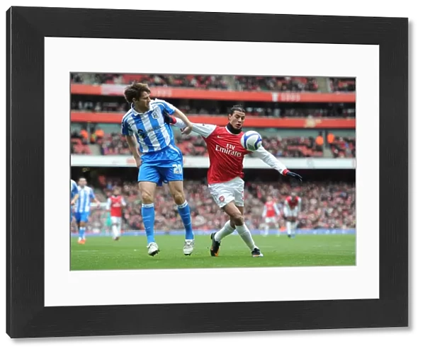 Marouane Chamakh (Arsenal) Kevin Kilbane (Huddersfield). Arsenal 2: 1 Huddersfield Town