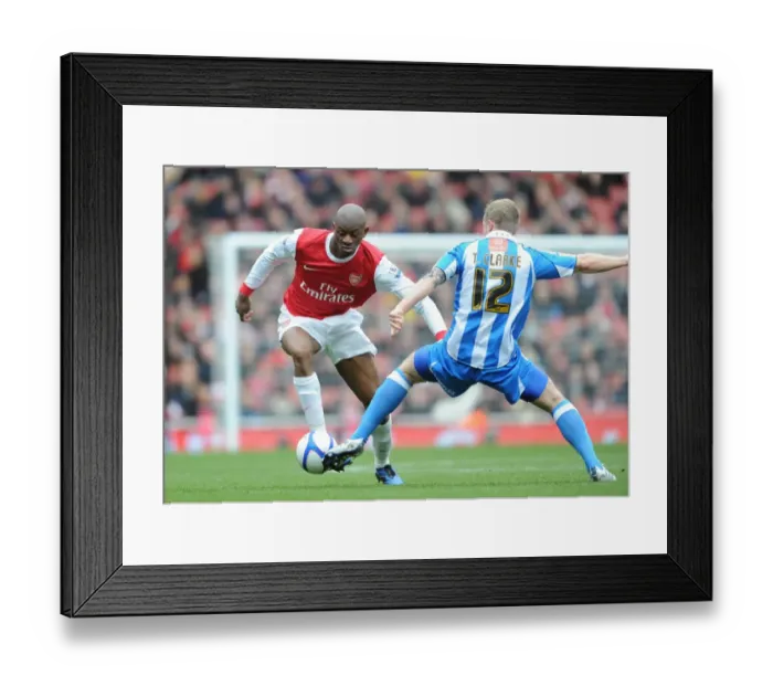 Framed Print : Abou Diaby (Arsenal) Tom Clarke (Huddersfield). Arsenal 2: 1 Huddersfield Town