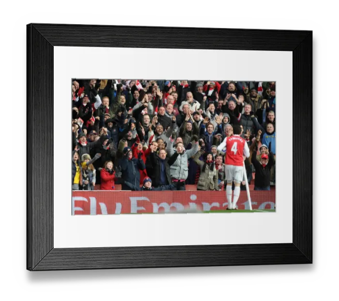 Framed Print : Cesc Fabregas celebrates scoring the 2nd Arsenal goal the the fans. Arsenal 2 Framed Print : Cesc Fabregas celebrates scoring the 2nd Arsenal goal the the fans. Arsenal 2