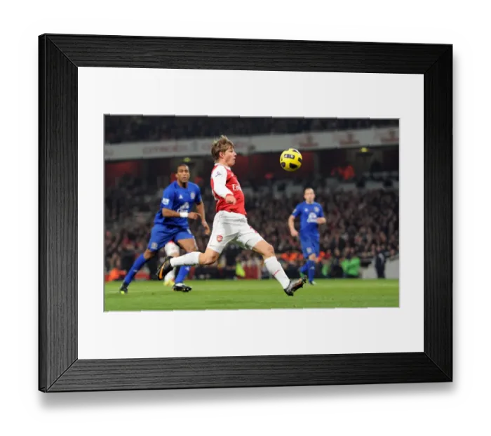 Framed Print : Arshavin Strikes First: Arsenal's 2-1 Victory Over Everton in the Premier League