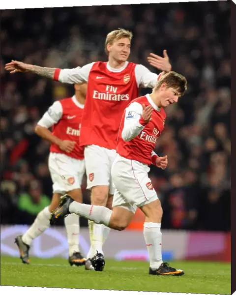 Andrey Arshavin celebrates scoring the 1st Arsenal goal with Nicklas Bendtner