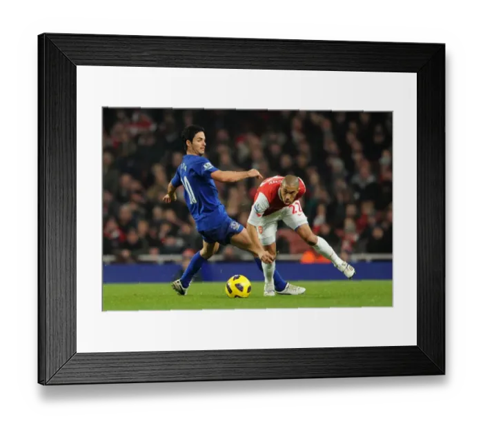 Framed Print : Gael Clichy (Arsenal) Mikel Arteta (Everton). Arsenal 2: 1 Everton. Barclays Premier League Framed Print : Gael Clichy (Arsenal) Mikel Arteta (Everton). Arsenal 2: 1 Everton. Barclays Premier League