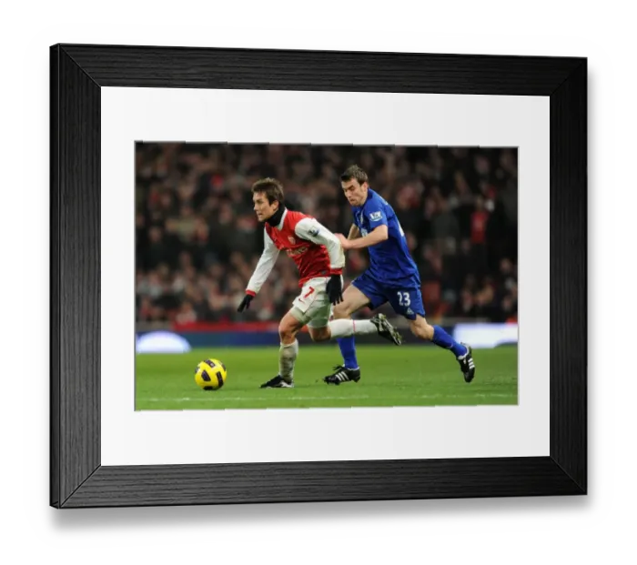 Framed Print : Tomas Rosicky (Arsenal) Seamus Coleman (Everton). Arsenal 2: 1 Everton. Barclays Premier League