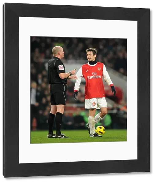 Tomas Rosicky (Arsenal) with the referee. Arsenal 2: 1 Everton. Barclays Premier League