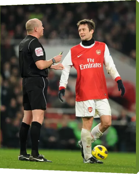 Tomas Rosicky (Arsenal) with the referee. Arsenal 2: 1 Everton. Barclays Premier League