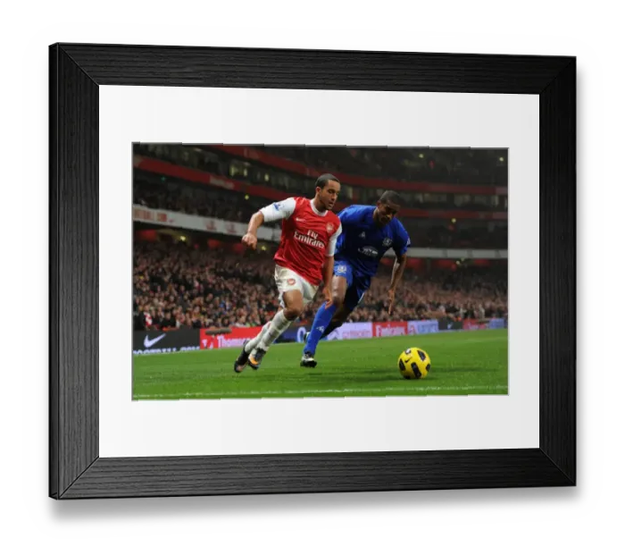 Framed Print : Theo Walcott Scores Against Sylvain Distin: Arsenal's 2-1 Victory Over Everton in the Barclays Premier League