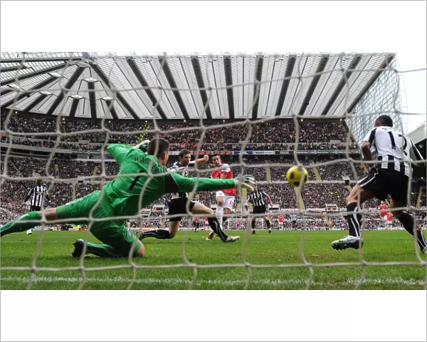 Robin van Persie shoots past Newcastle goalkeeper Steve Harper to score the 3rd Arsenal goal