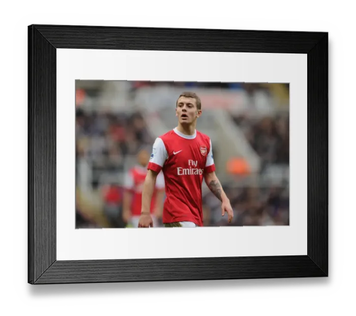Framed Print : Fierce Rivalry: Wilshere's Thrilling 4-4 Battle at St. James Park