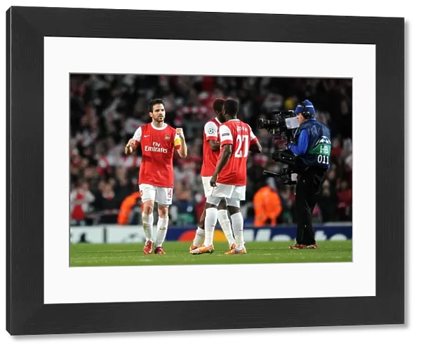 Cesc Fabregas and Emmanuel Eboue (Arsenal) celebrate after the match. Arsenal 2