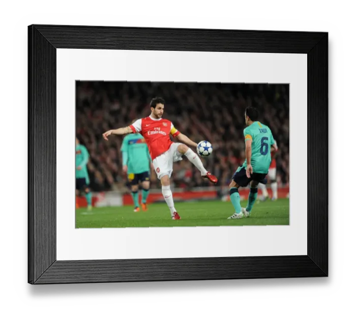 Framed Print : Cesc Fabregas vs Xavi: Arsenal's Victory Over Barcelona in the UEFA Champions League (2011)