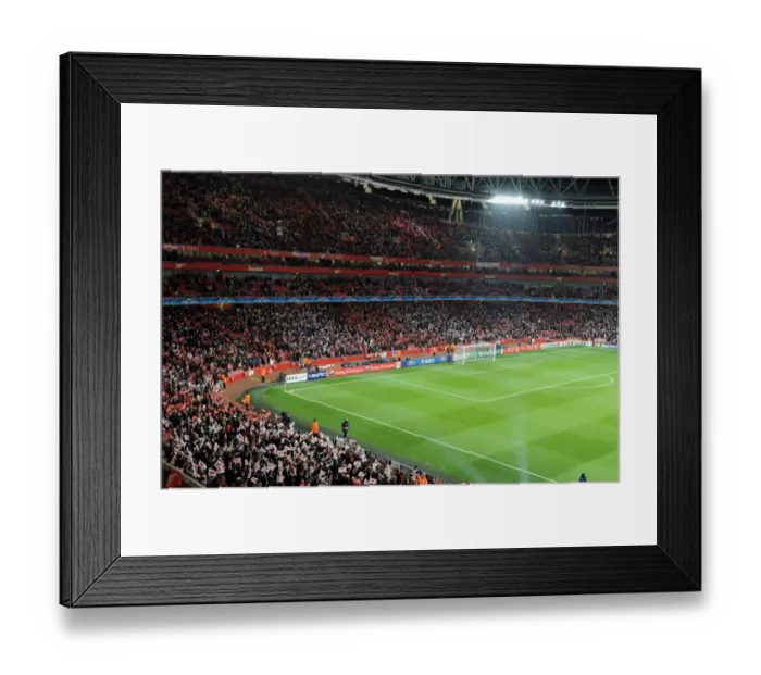Framed Print : Arsenal Fans Unite: Waving Flags Before the Epic Arsenal 2:1 Barcelona UEFA Champions League Match, Emirates Stadium Framed Print : Arsenal Fans Unite: Waving Flags Before the Epic Arsenal 2:1 Barcelona UEFA Champions League Match, Emirates Stadium