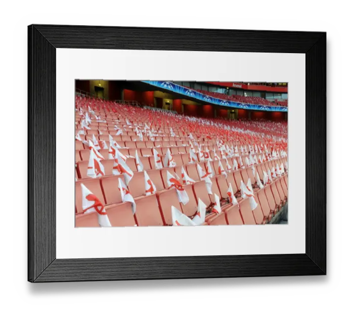 Framed Print : Flags for the fans are left on each seat. Arsenal 2: 1 Barcelona. UEFA Champions League Framed Print : Flags for the fans are left on each seat. Arsenal 2: 1 Barcelona. UEFA Champions League