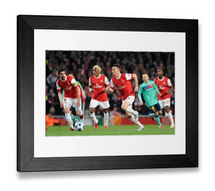 Framed Print : Arsenal's Unforgettable Victory: Koscielny and Fabregas Lead the Way vs. Barcelona in the UEFA Champions League