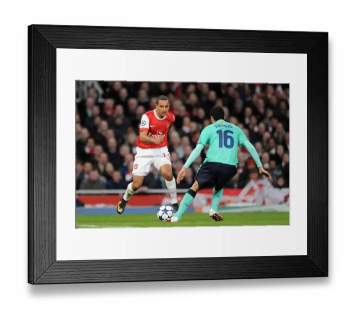 Framed Print : Theo Walcott (Arsenal) Sergio Busquets (Barcelona). Arsenal 2: 1 Barcelona Framed Print : Theo Walcott (Arsenal) Sergio Busquets (Barcelona). Arsenal 2: 1 Barcelona