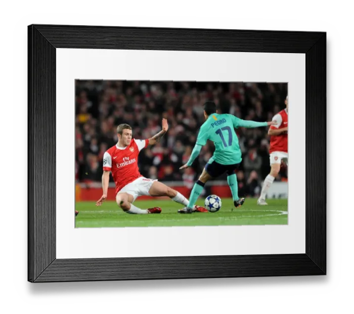 Framed Print : Arsenal's Jack Wilshere Scores Against Barcelona's Pedro Rodriguez in UEFA Champions League: Arsenal 2 - 1 Barcelona