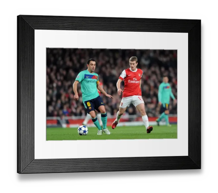 Framed Print : Jack Wilshere (Arsenal) Xavi (Barcelona). Arsenal 2: 1 Barcelona. UEFA Champions League