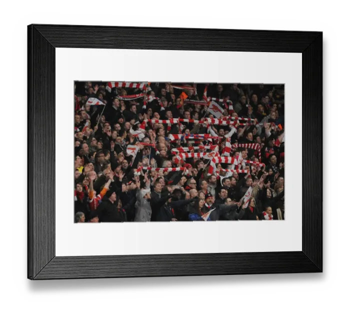 Framed Print : Arsenal fans celebrate. Arsenal 2: 1 Barcelona, UEFA Champions League, Emirates Stadium