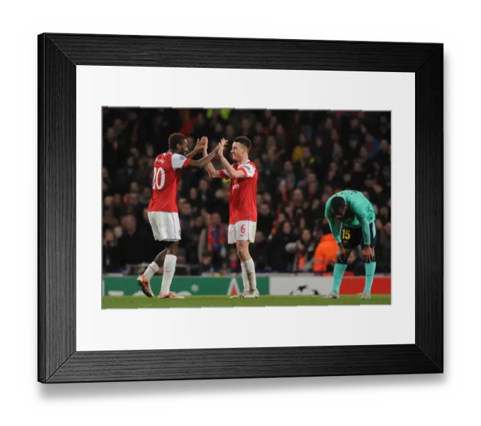 Framed Print : Johan Djourou and Laurent Koscielny (Arsenal) celebrates as a dejected Seydou Keita