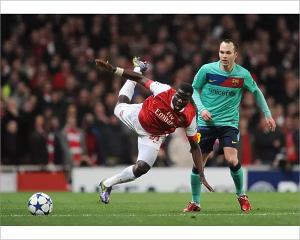 Emmanuel Eboue (Arsenal) Andres Iniesta (Barcelona). Arsenal 2: 1 Barcelona