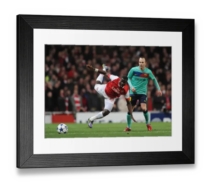 Framed Print : Emmanuel Eboue (Arsenal) Andres Iniesta (Barcelona). Arsenal 2: 1 Barcelona