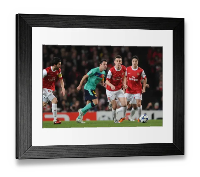 Framed Print : Laurent Koscielny (Arsenal) Xavi (Barcelona). Arsenal 2: 1 Barcelona, UEFA Champions League