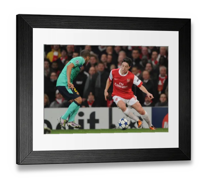 Framed Print : Samir Nasri (Arsenal) Daniel Alves (Barcelona). Arsenal 2: 1 Barcelona, UEFA Champions League