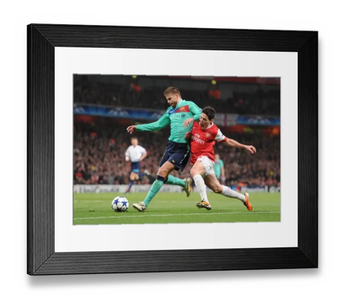 Framed Print : Samir Nasri (Arsenal) Gerard Pique (Barcelona). Arsenal 2: 1 Barcelona, UEFA Champions League Framed Print : Samir Nasri (Arsenal) Gerard Pique (Barcelona). Arsenal 2: 1 Barcelona, UEFA Champions League