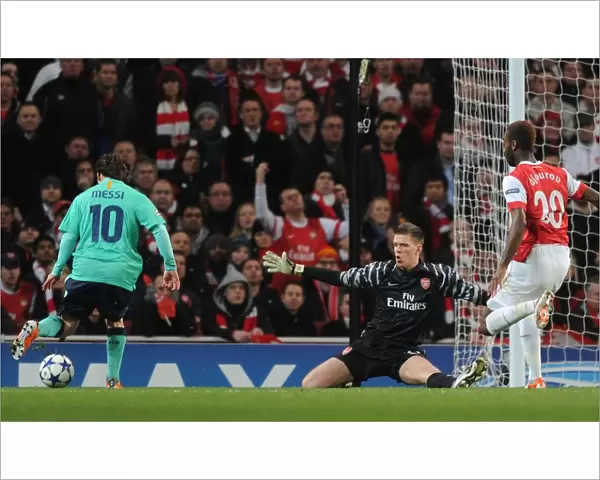 Arsenal goalkeeper Wojciech Szczesny closes down Barcelona forward Lionel Messi