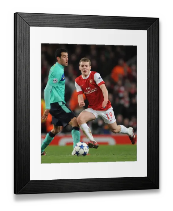 Framed Print : Arsenal's Jack Wilshere vs Barcelona's Sergio Busquets: A Battle in the Arsenal 2:1 Victory, UEFA Champions League, Emirates Stadium, 2011
