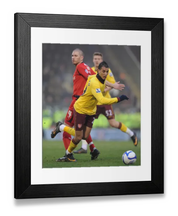 Framed Print : Marouane Chamakh (Arsenal) Ben Chorley (Orient). Leyton Orient 1: 1 Arsenal